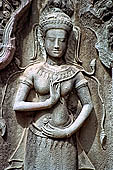 Ta Prohm temple - devatas sculpted on the gallery walls 